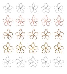 six different colors of metal flower charms in various sizes and shapes on a white background