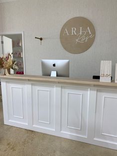 the front desk is clean and ready to be used for business purposes, as well as office supplies