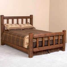 a wooden bed frame sitting on top of a white carpeted floor next to a wall