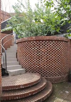 an outdoor area with brick steps and plants