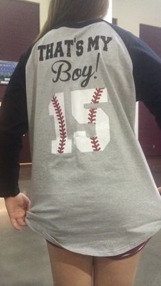 the back of a woman's shirt that says, that's my boy