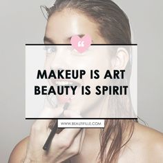 a woman holding a brush in front of her face with the words makeup is art beauty is spirit