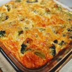 a casserole dish with broccoli and cheese