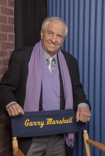 an older man holding a sign that says gary marshall