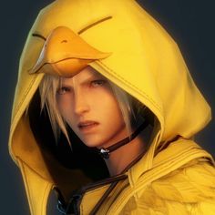 a person wearing a duck mask and yellow jacket with long blonde hair in front of a dark background