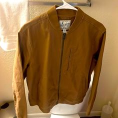 New Never Worn Medium Bomber Jacket Casual Leather Jacket For Spring, Casual Solid Leather Jacket With Pockets, Casual Leather Jacket For Fall Outdoor, Casual Long Sleeve Leather Jacket With Pockets, Casual Brown Spring Outerwear, Casual Leather Jacket With Pockets, Urban Outerwear With Zipper Closure For Everyday, Urban Everyday Outerwear With Zipper Closure, Spring Outerwear With Zipper Closure