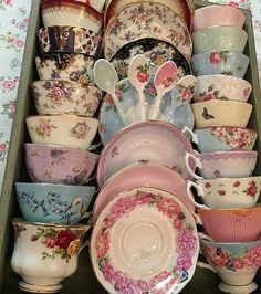 a drawer filled with lots of different colored dishes