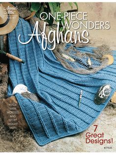 the cover of one - piece wonders afghans, featuring blue knitted blankets and hats