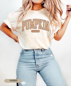 ⬇️ 》PLEASE READ TERMS BEFORE PURCHASE《 ⬇️ Embrace the cozy vibes of autumn with our Pumpkin Season T-Shirt! This eye-catching shirt features bold, retro-inspired checkered lettering that screams fall fun. Perfect for pumpkin patch visits, hayrides, or sipping your favorite pumpkin spice latte. Soft, warm, and brimming with autumn spirit - it's the ideal blend of comfort and style for those crisp fall days. A must-have for anyone who lives for pumpkin season and wants to show it off in vintage-in College Fall T-shirt With School Spirit, Cute College Tops For Fall, Retro Orange T-shirt For Fall, College Letter Print T-shirt For Fall, Trendy Fall Letter Print T-shirt, Fall White T-shirt For Loungewear, Trendy Halloween Tops For Loungewear, Trendy Letter Print T-shirt For Fall, Trendy Halloween Loungewear Tops