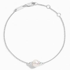 Premium Akoya Cultured Pearl Bracelet (7mm) - Silver. Both classic and elegant, this bracelet features a lustrous Akoya cultured pearl held on a delicate cable chain. The length of the bracelet can be adjusted from 6 to 7 inches to suit individual preference. Classic White Gold Bracelets With Pearl Drop, Classic White Gold Bracelet With Pearl Drop, Formal White Gold Bracelets With Pearl Chain, Elegant White Gold Pearl Jubilee Bracelet, Formal White Gold Jubilee Pearl Bracelet, Classic Sterling Silver Oyster Bracelet As Gift, Classic White Chain Bracelet With Pearl Drop, Classic White Gold Pearl Bracelet As Gift, Classic White Gold Pearl Bracelet With Charm