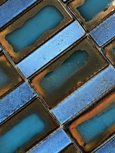 blue and brown tiles with small holes in them