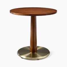 a round wooden table with a metal base on a white background, it is made of wood and brass