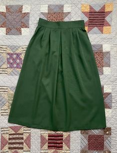 Green 70s skirt with wide cut high-rise waistband, pockets on the sides, and back zipper closure. Waist has elastic on back for extra give.  waist: 14" length: 31.5" free hip Cheap Green Relaxed Fit Skirt, 70s Skirt, Green Midi Skirt, Skirt Pockets, Green Skirt, Vintage 1970s, Costume Ideas, Halloween Costume, Midi Skirt