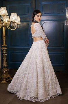 This ivory lehenga set features all over pearl, sequin, crystals, cutdana embroidery and a statement embroidered full sleeve blouse. Paired with an embellished hand embroidered dupatta in net.DELIVERY TIMEPlease allow 8-12 weeks for your outfit to arrive.FABRIC DETAILSNetProfessional cleaning only. Ivory Bridal Lehenga, Hand Embroidered Dupatta, Ivory Lehenga, Cutdana Embroidery, Full Sleeve Blouse, Embroidered Dupatta, Ivory Bridal, 12 Weeks, Bridal Lehenga