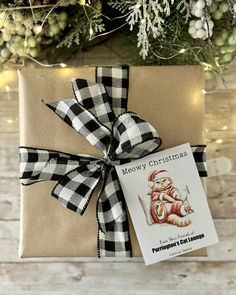 Illustration of a grumpy cat dressed up in Santa suit, propped against pillows with the headline, Meowy Christmas. Custom text can be added at the bottom of the seed packet. Creative Gift Tags, Santa Claws, Cute Cat Illustration, Meowy Christmas, Custom Gift Tags, Seed Packets, Promotional Item, Gift List, Christmas Gift Tags