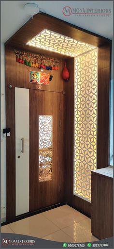 an entry way with wooden doors and decorative glass panels on the side wall, in front of a white refrigerator