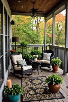 a porch with chairs and plants on it