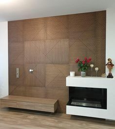 a modern living room with wood paneling on the wall and a fireplace in the center