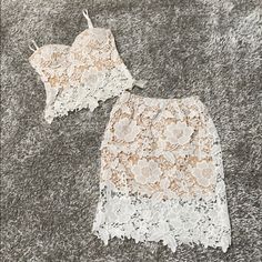 Brand New Without Tags. White Lace Over Nude. The Top Has A Side Zipper And The Skirt Is A Pull Up. Top Is Size Xs And Skirt Is Small. Top Has Padding And The Straps Are Adjustable. Sold As A Set! Two Piece.Perfect For A Bridal Shower,Rehearsal Dinner, Bachelorette Party Or Date Night! Top Xs And Bottom Is Small! Offers Accepted White Fitted Feminine Mini Skirt, White Fitted Lace Mini Skirt, Elegant White Lace Mini Skirt, White Feminine Skirt For Party, White Feminine Party Skirt, Feminine White Party Skirt, Feminine White Party Mini Skirt, Chic White Lace Mini Skirt, White Lace Skirt For Spring