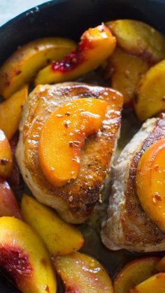 pork chops and peaches in a skillet ready to be served for dinner