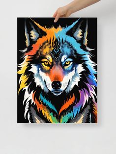 a person holding up a colorful wolf poster