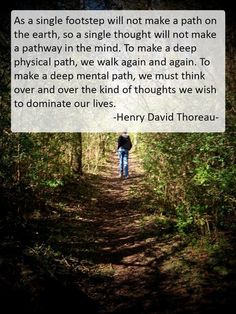 a person walking down a path in the woods with a quote from henry david thoreau