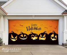 a garage door decorated for halloween with pumpkins