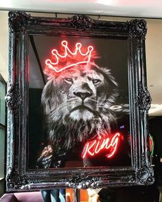 a lion with a crown on it's head in a frame