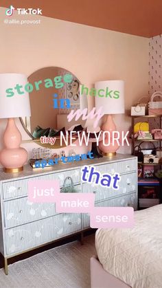 there are two lamps on the dresser in this bedroom, one is pink and the other is white