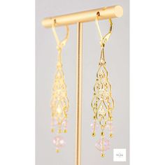 You will look so pretty in these Pink Glass Filigree Drop Earrings! Enhance your beauty with these Pink Glass Filigree Earrings! Sweet and elegant these stunning earrings are a must-have for any wardrobe, featuring lovely faceted pink briolette glass beads, micro-faceted white glass beads, and gold seed beads. The gold-plated filigree and lever backs add a touch of elegance to these 2.75 inch long earrings. Perfect for adding a touch of romance and charm to your look, these gold filigree dangle Elegant Rose Gold Earrings With Dangling Beads, Gold Crystal Earrings With Dangling Beads For Wedding, Gold Delicate Crystal Earrings For Party, Delicate Gold Crystal Earrings For Party, Delicate Gold Crystal Party Earrings, Rose Gold Jewelry With Dangling Beads For Gift, Elegant Gold Crystal Earrings With Dangling Beads, Dainty Gold Beaded Earrings, Feminine Gold Jewelry For Jewelry Making