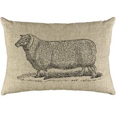 a black and white pillow with a sheep on it's side, in front of a