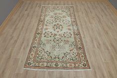 a rug is laying on the floor in a room with hardwood floors and walls,