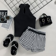 Elevate your little one's summer style with our charming High Neck Sleeveless Top and Plaid Shorts Set – a perfect blend of fashion and comfort! The high neck sleeveless top, in its elegant design, offers a touch of sophistication while keeping your child cool on warm summer days. The sleeveless cut allows for easy movement, while the high neckline adds a trendy twist to this classic look. Paired with the top are matching plaid shorts that effortlessly capture a playful and stylish vibe. The pla High Neck Sleeveless Top, Sets Summer, Summer Girl, High Neck Sleeveless, Belted Shorts, Girls Summer Outfits, Plaid Shorts, Sleeveless Vest, Outfit Set