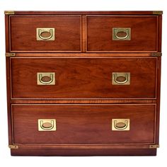 a wooden dresser with three drawers and brass handles