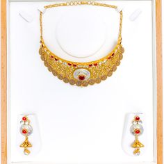 Experience sheer elegance with our Exclusive Enameled Kundan Choker Set, boasting exquisite Kundan stones and crafted with 22k antique gold weighing 63.7 grams. This opulent set features an adjustable length of 14" with 1" links and a secure hook lock. The stunning choker has a width of 1.75" and a drop length of 0.75". It also includes matching earrings, 2.3" in length with screw backs. Make a bold statement with this unique and timeless piece, finished with a regal antique gold shine. PRODUCT Yellow Gold Bridal Necklace With Meenakari, Ceremonial 22k Gold Meenakari Jewelry, 22k Yellow Gold Kundan Necklace With Meenakari, Yellow Gold Round Temple Necklace With Meenakari, 22k Gold Temple Necklace With Meenakari, Luxury Gold Necklaces With Meenakari, Formal 22k Gold Meenakari Temple Necklace, Gold Meenakari Kundan Necklace In 22k Gold, Gold 22k Meenakari Kundan Necklace