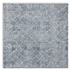 a blue and white rug with an abstract design