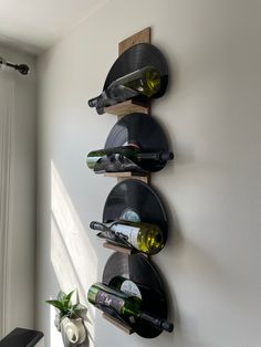 a wall mounted wine rack holding several bottles