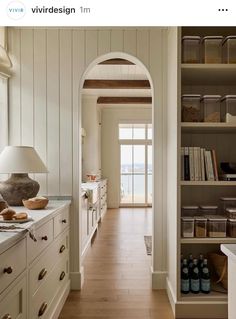 an open kitchen with white cabinets and wood flooring is featured in the magazine vivre