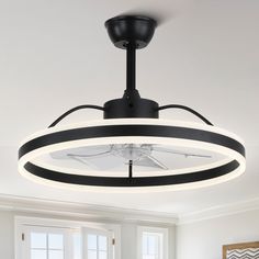 a black and white circular light fixture in a living room