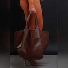 Soft Oversized Brown Leather Bag Chic Bucket Bag Tote With Pockets, Chic Bucket Tote Bag With Pockets, Chic Large Bag For Errands, Chic Large Shoulder Bag For Errands, Everyday Faux Leather Bags With Pockets, Chic Large Shoulder Bag With Removable Pouch, Brown Bucket Bag With Double Handle And Pockets, Brown Hobo Bag With Pockets For Shopping, Chic Tote Bag With Pockets