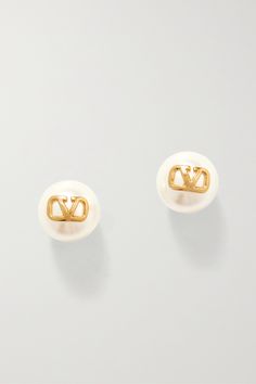 Valentino Garavani debuted the 'V-Logo' in 1968 at its runway show at the legendary Sala Bianca - that same emblem is featured on these delicate faux pearl earrings in gold-tone metal. Wear yours alone or as part of a curated stack. Designer Gold-tone Logo Plaque Earrings For Formal Occasions, Luxury Logo Earrings, Designer White Earrings For Anniversary, Designer White Earrings For Evening, White Formal Jewelry With Logo Charm, Formal White Jewelry With Logo Charm, Workwear Women, Professional Workwear, Beauty Calendar