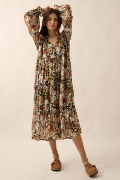 A floral-print chiffon midi dress with the following features: Deep V neckline. Long sleeves. Flared cuffs. Tiered ruffle design. Thigh length lining. Calf length. Relaxed fit. 100% polyester. Hand wash, line dry. Model Info: Height: 5 ft 9 in | Bust: 31 in | Waist: 24 in | Hips: 34 in | Wearing Size S. Weird Flowers, Patterned Midi Dress, Ruffle Design, Autumn Wardrobe, Floral Print Chiffon, Chiffon Midi Dress, Autumn Dress, Tiered Midi Dress, Prairie Dress