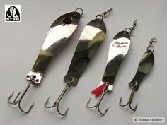 three fishing lures are shown with hooks