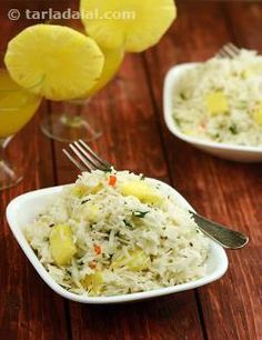 two white bowls filled with rice and pineapples