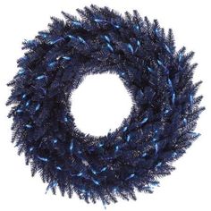 a blue christmas wreath on a white background