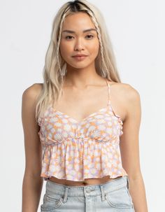 Rsq Daisy X-Back Babydoll Top. All Over Print. Adjustable X Back Ties. Ruffle Hem. Elastic Waist. 100% Rayon. Hand Wash. Imported. Model Is Wearing A Size Small. Model Measurements:height: 5'8" Bust: 30"waist: 23"hips: 35" Flirty White Camisole Top, Flirty White Top For Vacation, Flirty White Tops For Vacation, Playful Sleeveless Crop Top For Spring, Cute Floral Print Camisole Top, Cute Fitted Tops For The Beach, Cute Spring Beach Tops, Cute Ruffled Cami Top, Playful Ruffled Tops For Vacation