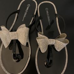 Jelly Thong With Crystal Bow And Rhinestones. Rhinestone Synthetic Flip Flops For Party, Party Flip Flops With Rhinestones, Black Rhinestone Flip Flops For Beach, Black Bling Sandals For The Beach, Beach Sandals With Bling In Black, Beach Bling Black Sandals, Knee High Sneakers, Mk Sandals, Silver Flip Flops