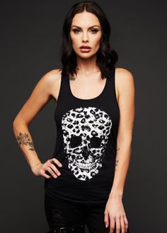 Match made in heaven! A leopard print skull on a black tee? Yes, please! The rock 'n' roll attitude of this sleeveless t-shirt will have you ready to hit the road in style! Versatile, edgy and comfy, that's the spirit behind this rad tank top! The black top features a beautiful leopard print skull design in the front. The lightweight tank top is fabricated from supersoft 60% cotton and 40% polyester, has a very comfortable slightly loose fit cut and a racerback cut back. Available in sizes S, M, Leopard Skull, Black Lace Choker Necklace, Skull Tank Top, Black Lace Choker, Gothic Tops, Attitude Clothing, Leather Bustier, Skull Tank, Dream Outfits