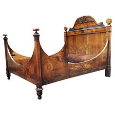 an old wooden bed with two posts and no headboard or foot board is shown