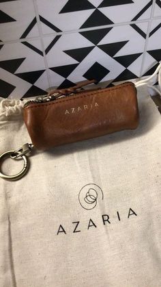 Used azaria lipstick holder coin purse with small and medium dust bag. Seems to be a rare item, no longer made. Good used condition Pouch Bag With Key Clip For Gift, Pouch Bag With Key Clip As Gift, Coin Purse With Key Clip As Gift, Gift Coin Purse With Key Clip, Vintage Rectangular Coin Purse For Everyday, Vintage Rectangular Coin Purse, Rectangular Brown Coin Purse With Key Clip, Brown Rectangular Coin Purse With Key Clip, Brown Coin Purse For Gifts